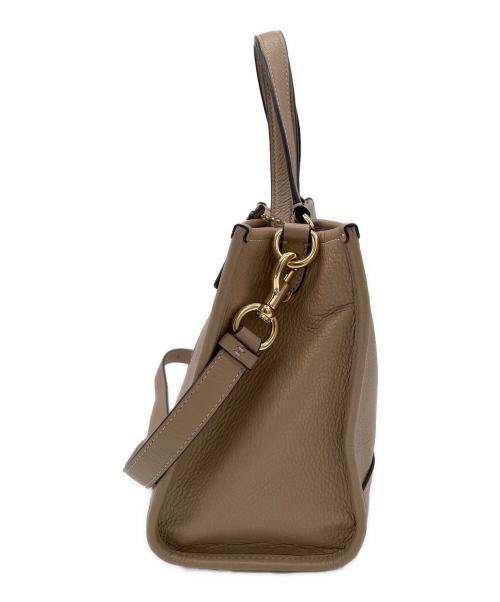 COACH（コーチ）COACH (コーチ) デンプシー キャリーオール ウィズ パッチ　2WAYバッグ ベージュの古着・服飾アイテム