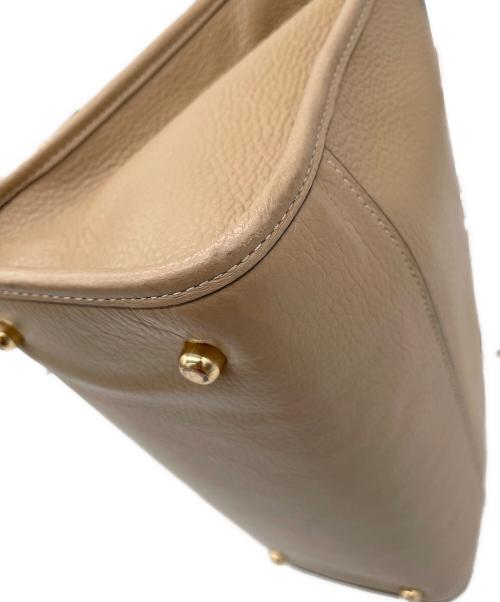 COACH（コーチ）COACH (コーチ) デンプシー キャリーオール ウィズ パッチ　2WAYバッグ ベージュの古着・服飾アイテム