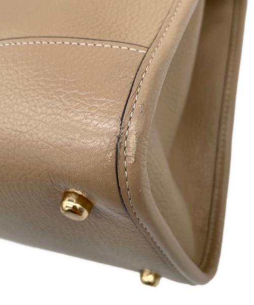 COACH（コーチ）COACH (コーチ) デンプシー キャリーオール ウィズ パッチ　2WAYバッグ ベージュの古着・服飾アイテム