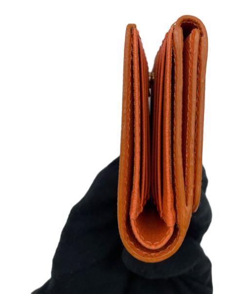 TOPKAPI（トプカピ）TOPKAPI (トプカピ) 2つ折り財布 オレンジの古着・服飾アイテム