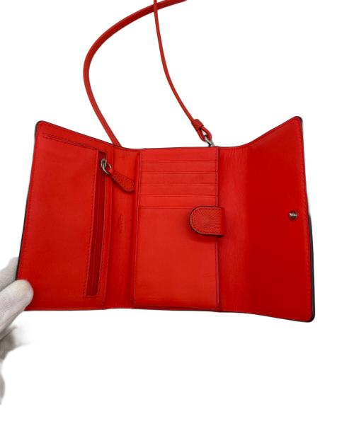 COACH（コーチ）COACH (コーチ) 三つ折り財布 オレンジの古着・服飾アイテム