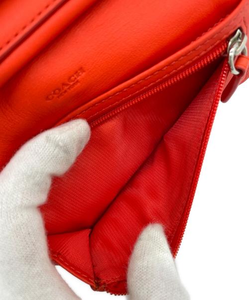COACH（コーチ）COACH (コーチ) 三つ折り財布 オレンジの古着・服飾アイテム