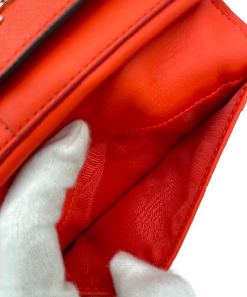 COACH（コーチ）COACH (コーチ) 三つ折り財布 オレンジの古着・服飾アイテム