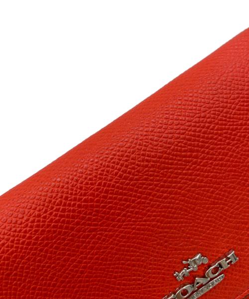 COACH（コーチ）COACH (コーチ) 三つ折り財布 オレンジの古着・服飾アイテム