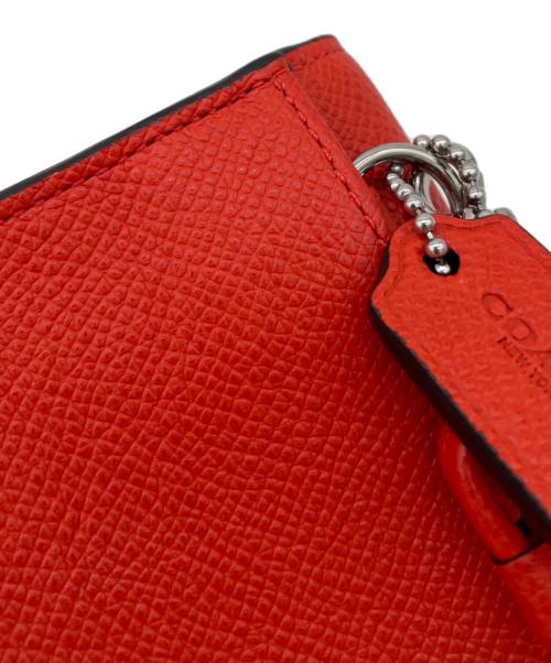 COACH（コーチ）COACH (コーチ) 三つ折り財布 オレンジの古着・服飾アイテム