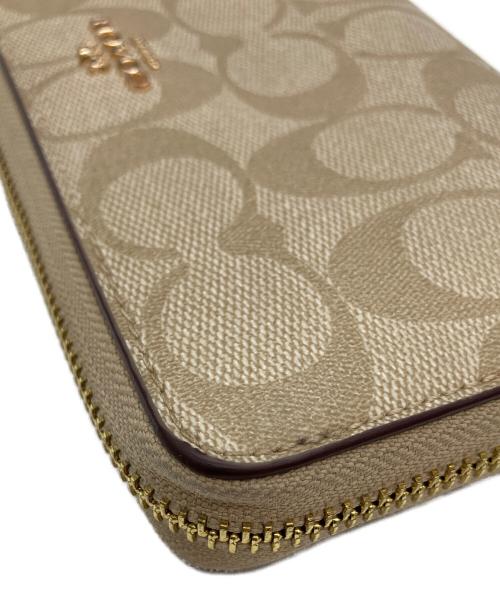 COACH（コーチ）COACH (コーチ) 長財布 ベージュ×ピンクの古着・服飾アイテム