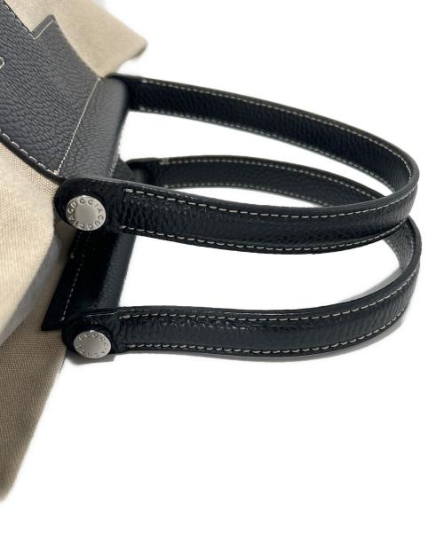 IACUCCI（イアクッチ）IACUCCI (イアクッチ) キャンバスバッグ ブラック×アイボリーの古着・服飾アイテム