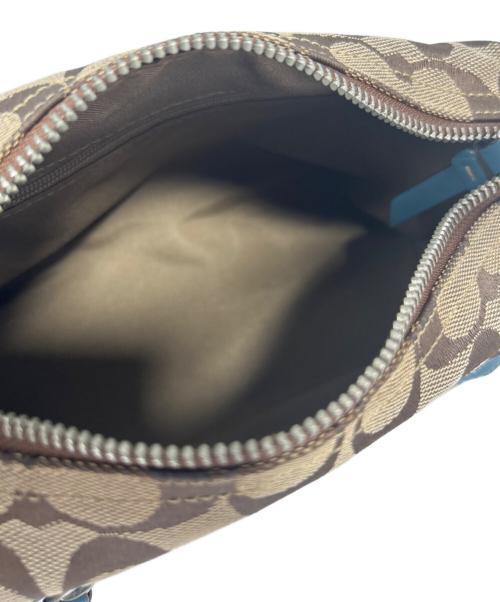 COACH（コーチ）COACH (コーチ) アクセサリーポーチ ベージュ×ブルーの古着・服飾アイテム