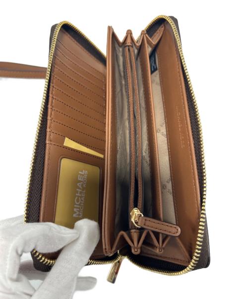 MICHAEL KORS（マイケル・コース）MICHAEL KORS (マイケル・コース) ラウンドファスナー財布 ブラウンの古着・服飾アイテム