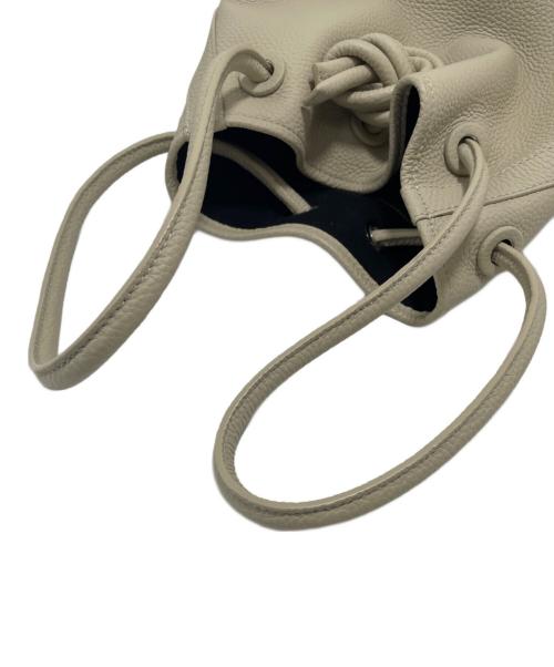 VASIC（ヴァジック）VASIC (ヴァジック) 巾着バッグ アイボリーの古着・服飾アイテム