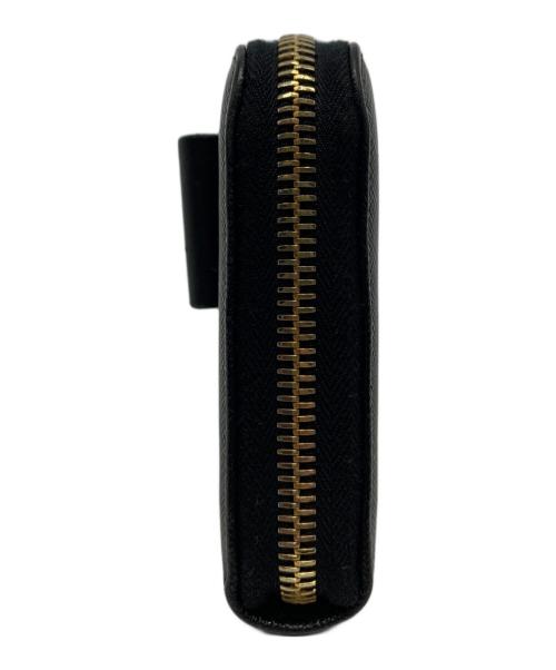 PRADA（プラダ）PRADA (プラダ) サフィアーノ ラウンドファスナーリボンウォレット ブラックの古着・服飾アイテム
