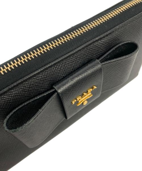 PRADA（プラダ）PRADA (プラダ) サフィアーノ ラウンドファスナーリボンウォレット ブラックの古着・服飾アイテム