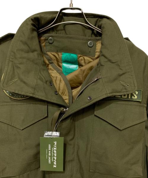 アリス・ギア・アイリス（アリス・ギア・アイリス）アリス・ギア・アイリス (アリス・ギア・アイリス) M65ジャケット オリーブ サイズ:XL 未使用品の古着・服飾アイテム