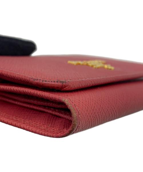 PRADA（プラダ）PRADA (プラダ) サフィアーノ コンパクトウォレット ピンクの古着・服飾アイテム