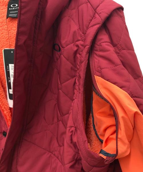 OAKLEY（オークリー）OAKLEY (オークリー) 中綿ジャケット レッド サイズ:XL 未使用品の古着・服飾アイテム