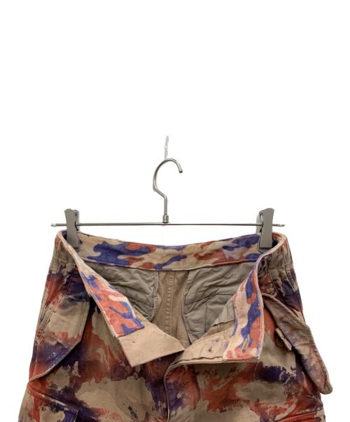 ISAMU KATAYAMA BACKLASH（イサムカタヤマ・バックラッシュ）ISAMU KATAYAMA BACKLASH (イサムカタヤマ・バックラッシュ) 迷彩ペイントカーゴパンツ ブラウン サイズ:XSの古着・服飾アイテム