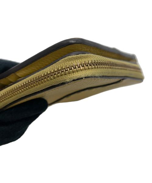 TORY BURCH（トリーバーチ）TORY BURCH (トリーバーチ) 2つ折り財布 ベージュの古着・服飾アイテム