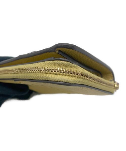 TORY BURCH（トリーバーチ）TORY BURCH (トリーバーチ) 2つ折り財布 ベージュの古着・服飾アイテム