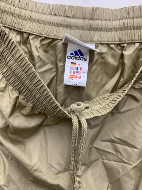 adidas（アディダス）adidas (アディダス) ナイロンパンツ ベージュ サイズ:Lの古着・服飾アイテム