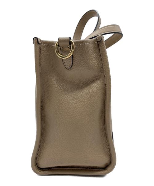 COACH（コーチ）COACH (コーチ) 2WAYバッグ　デンプシーキャリーオール ベージュの古着・服飾アイテム