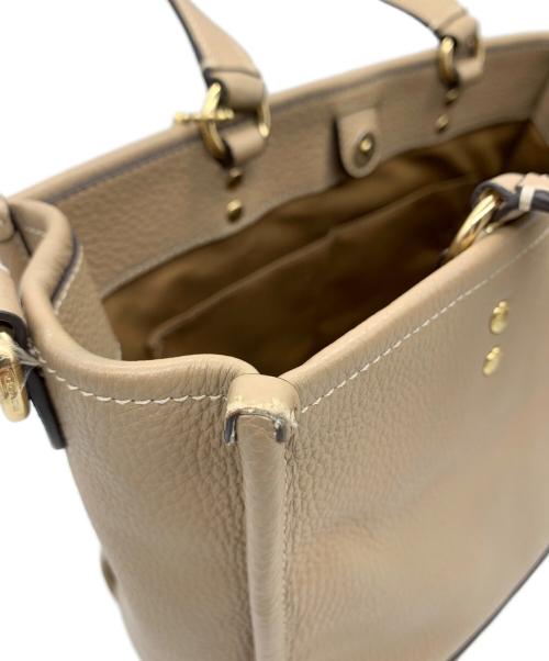 COACH（コーチ）COACH (コーチ) 2WAYバッグ　デンプシーキャリーオール ベージュの古着・服飾アイテム
