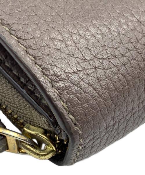 TORY BURCH（トリーバーチ）TORY BURCH (トリーバーチ) 2つ折り財布 グレーの古着・服飾アイテム