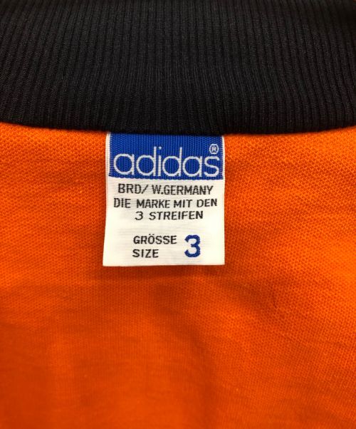 adidas（アディダス）adidas (アディダス) DESCENTE/W.GERMANY VINTAGE TRACK JKT　箱付き オレンジ×ブラック サイズ:3の古着・服飾アイテム