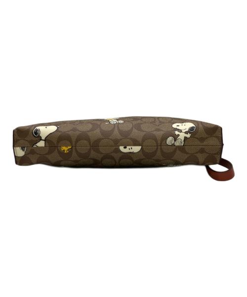 COACH（コーチ）COACH (コーチ) PEANUTS (ピーナッツ) クラッチバッグ ベージュの古着・服飾アイテム