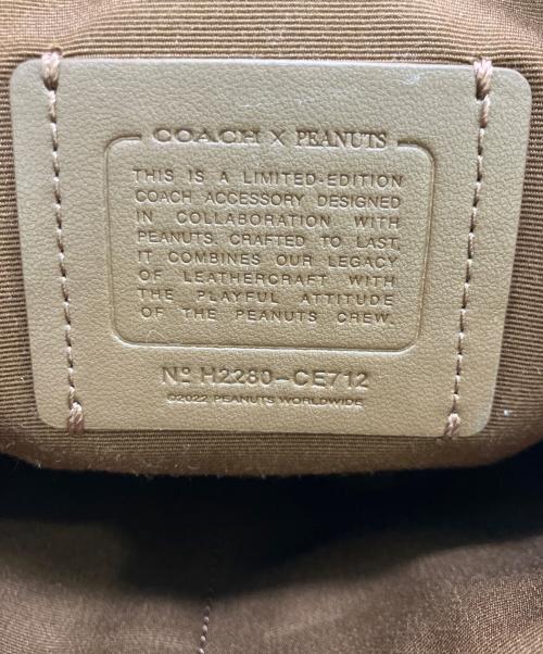 COACH（コーチ）COACH (コーチ) PEANUTS (ピーナッツ) クラッチバッグ ベージュの古着・服飾アイテム