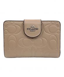 COACH（コーチ）の古着「ミディアム コーナー ジップ ウォレット・シグネチャー」｜トープ