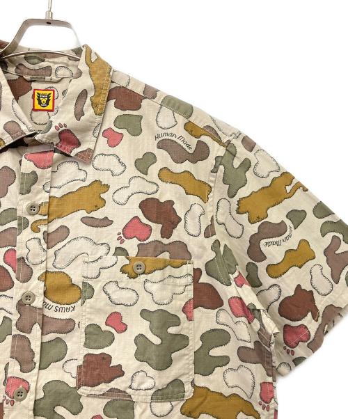 HUMAN MADE（ヒューマンメイド）HUMAN MADE (ヒューマンメイド) KAWS (カウズ) 半袖シャツ ベージュ サイズ:XLの古着・服飾アイテム