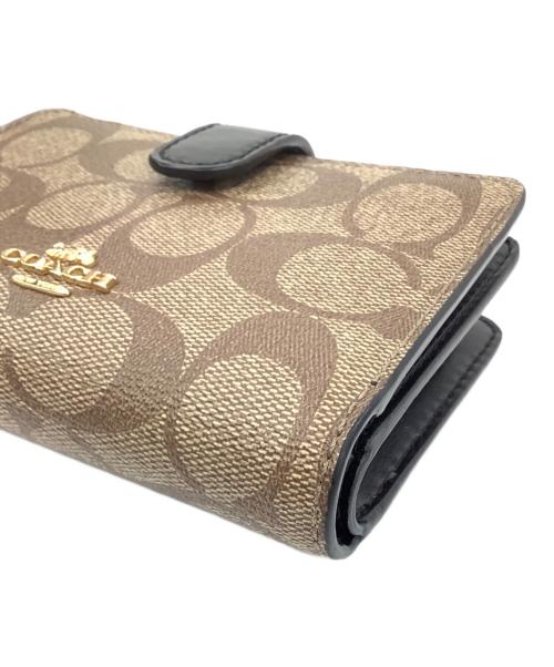 COACH（コーチ）COACH (コーチ) 2つ折り財布 ベージュ×ブラックの古着・服飾アイテム