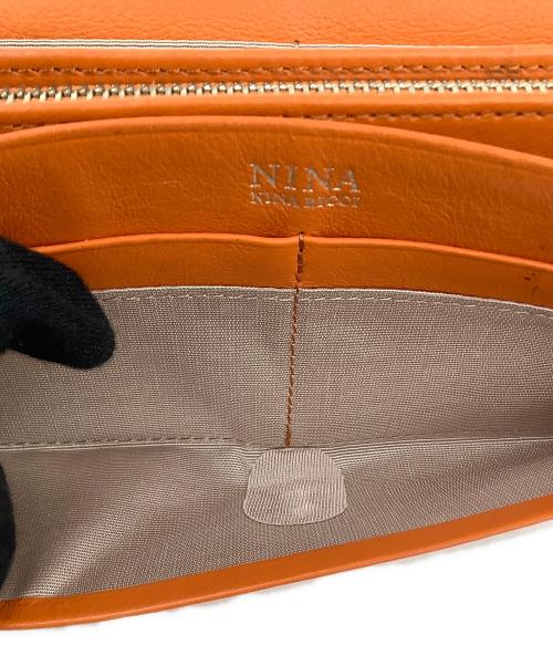 NINA RICCI（ニナリッチ）NINA RICCI (ニナリッチ) ディエップパース長財布 オレンジの古着・服飾アイテム