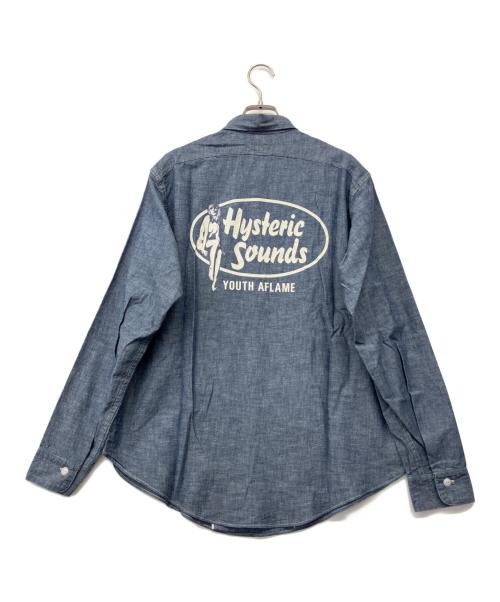 Hysteric Glamour（ヒステリックグラマー）Hysteric Glamour (ヒステリックグラマー) BIG YANK (ビッグヤンク) HYS SOUNDS プリント 長袖 シャンブレー ワーク シャツ インディゴ サイズ:M 未使用品の古着・服飾アイテム
