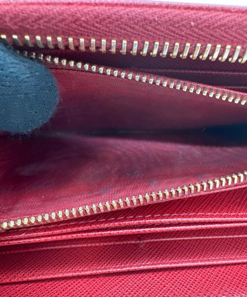 PRADA（プラダ）PRADA (プラダ) リボン付ラウンドファスナー長財布 サフィアーノ フィオッコ  レッドの古着・服飾アイテム