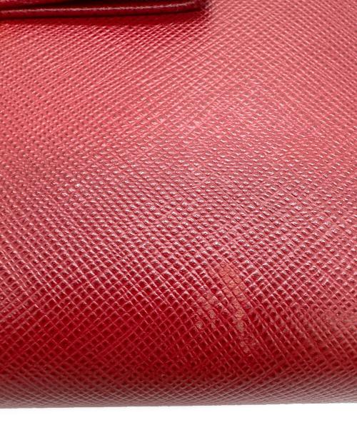 PRADA（プラダ）PRADA (プラダ) リボン付ラウンドファスナー長財布 サフィアーノ フィオッコ  レッドの古着・服飾アイテム