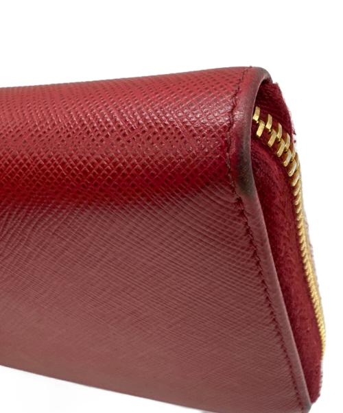 PRADA（プラダ）PRADA (プラダ) リボン付ラウンドファスナー長財布 サフィアーノ フィオッコ  レッドの古着・服飾アイテム