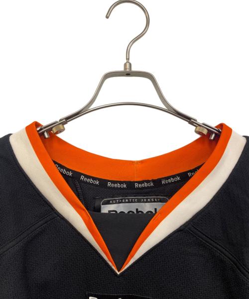 REEBOK（リーボック）REEBOK (リーボック) ゲームシャツ ブラック×オレンジ サイズ:56の古着・服飾アイテム