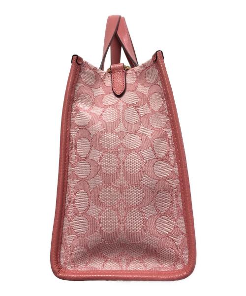 COACH（コーチ）COACH (コーチ) デンプシー キャリーオール　シグネチャー ピンクの古着・服飾アイテム
