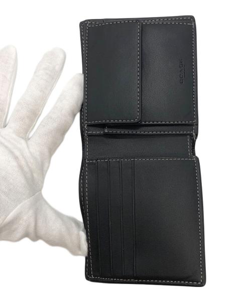 COACH（コーチ）COACH (コーチ) シグネチャーモノグラムプリント　2つ折り財布 ブラック×ブラウンの古着・服飾アイテム