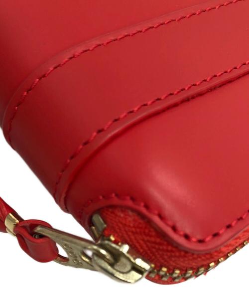 COMME des GARCONS（コムデギャルソン）COMME des GARCONS (コムデギャルソン) ビッグボウ　ラウンドファスナー財布 レッドの古着・服飾アイテム