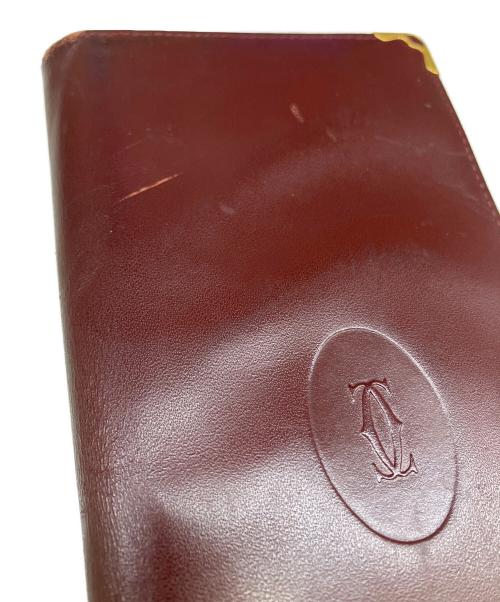Cartier（カルティエ）Cartier (カルティエ) 二つ折り長財布 ボルドーの古着・服飾アイテム