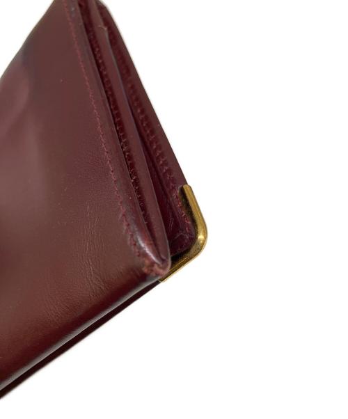 Cartier（カルティエ）Cartier (カルティエ) 二つ折り長財布 ボルドーの古着・服飾アイテム