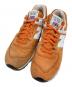 NEW BALANCE（ニューバランス）の古着「ローカットスニーカー」｜オレンジ