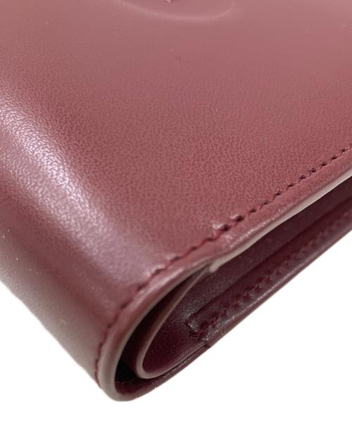 Cartier（カルティエ）Cartier (カルティエ) マストライン　2つ折り財布 ボルドーの古着・服飾アイテム