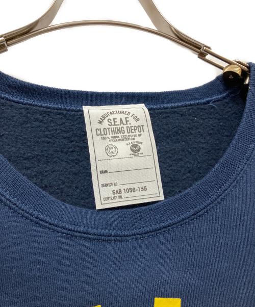 S.E.A.F. CLOTHING DEPOT（世田谷ベース）S.E.A.F. CLOTHING DEPOT (世田谷ベース) プリントスウェット ネイビー×イエロー サイズ:Lの古着・服飾アイテム