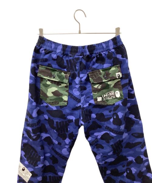 A BATHING APE（ア ベイシング エイプ）A BATHING APE (ア ベイシング エイプ) UNDEFEATED (アンディフィーテッド) パンツ ブルー サイズ:Mの古着・服飾アイテム