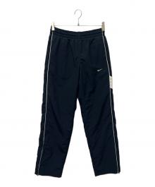 NIKE（ナイキ）の古着「ナイロンパンツ」｜ネイビー