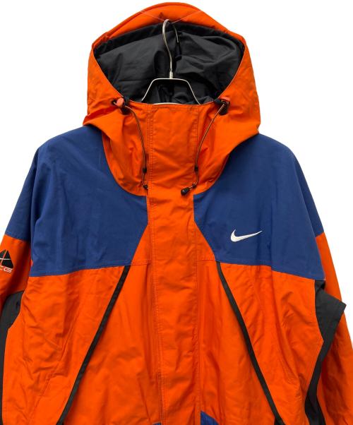 NIKE ACG（ナイキエーシージー）NIKE ACG (ナイキエーシージー) ナイロンジャケット オレンジ×ブルー サイズ:ＸＬの古着・服飾アイテム