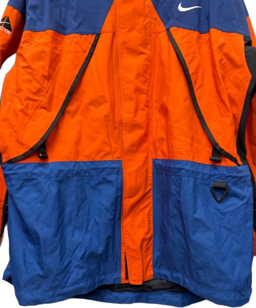 NIKE ACG（ナイキエーシージー）NIKE ACG (ナイキエーシージー) ナイロンジャケット オレンジ×ブルー サイズ:ＸＬの古着・服飾アイテム